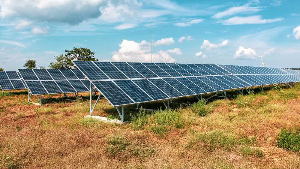 A certified installer commissioning a farm solar system