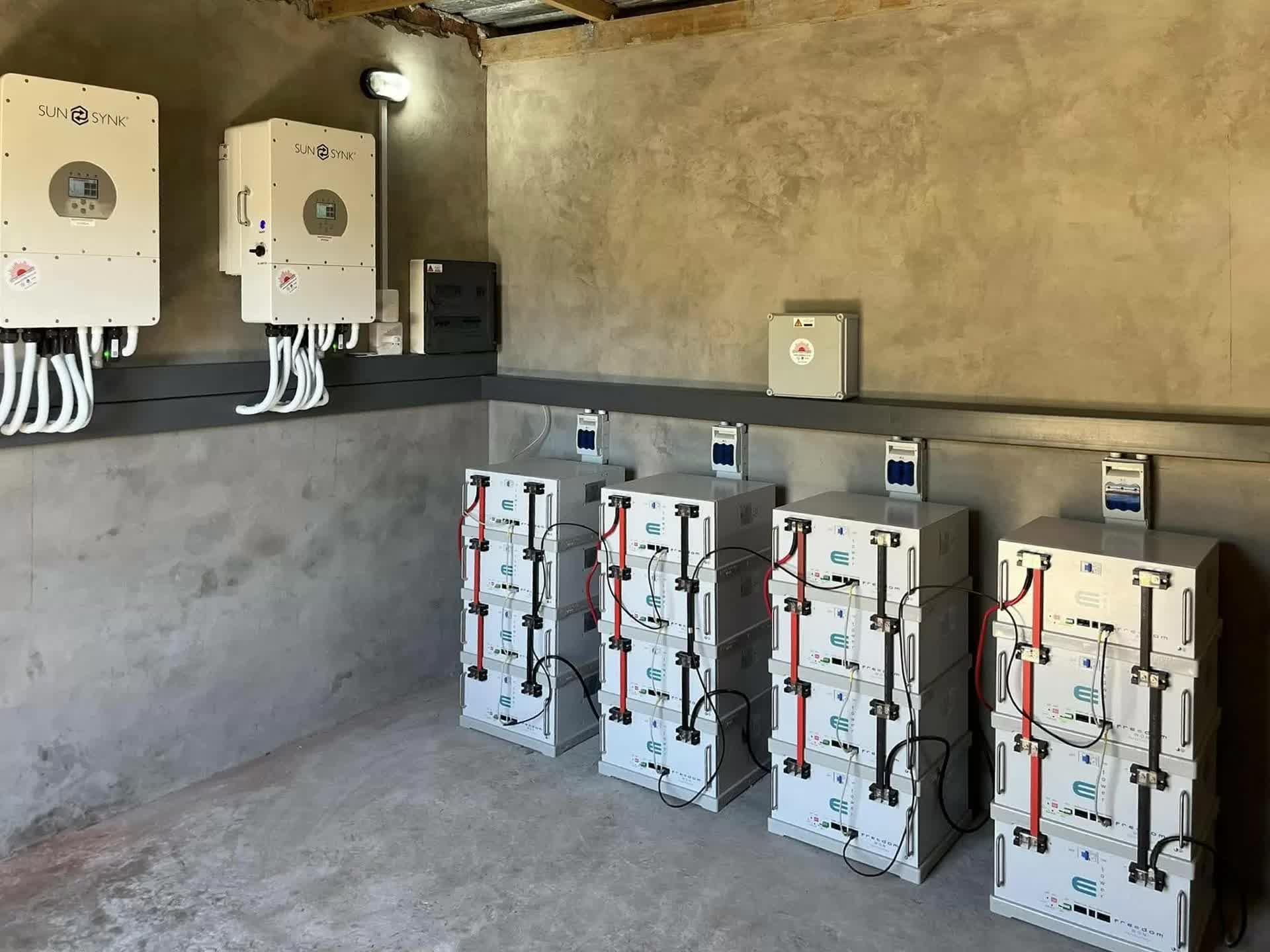 Solar panels beside farm buildings