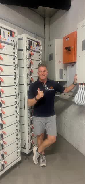 Greg Ball of SA Off Grid Power in a completed battery and inverter room
